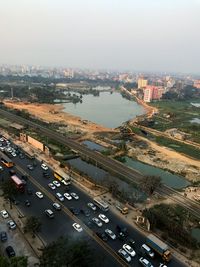 High angle view of city street and buildings against sky