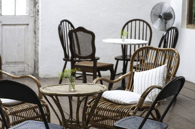 Empty chairs and table against wall at home