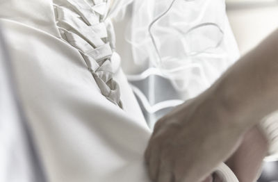 High angle view of white fabric on bed