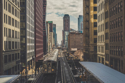 Modern buildings in city against sky