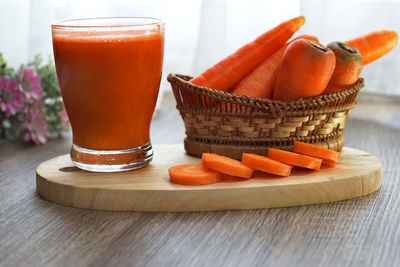 Close-up of orange juice on table