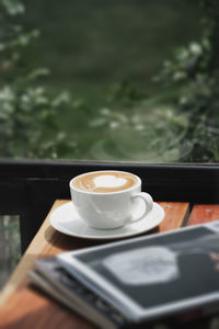 Close-up of coffee cup on table