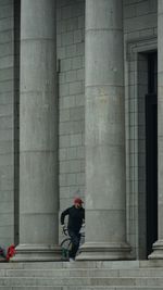 Rear view of woman walking in building