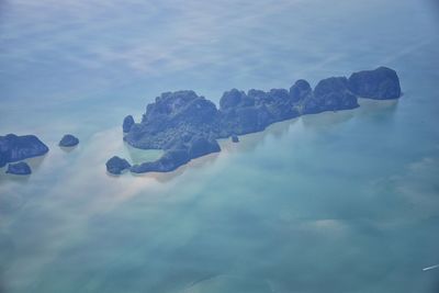 Panoramic view of rocks in sea against sky