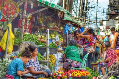 People at market stall