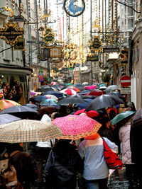 People at market stall in city