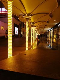 Empty illuminated corridor of building