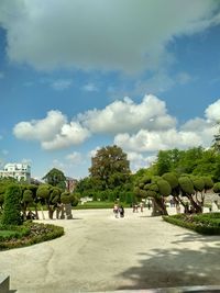 Group of people in park against sky