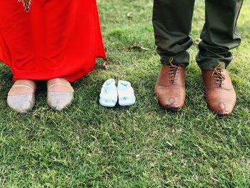 Low section of people standing on field