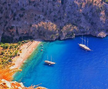 High angle view of boats moored at harbor