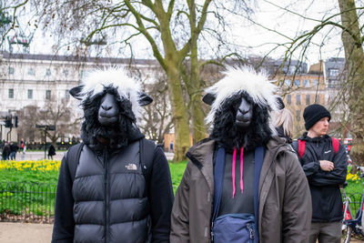 Portrait of people standing in park during winter