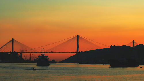 Scenic view of suspension bridge at sunset