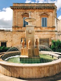 Fountain in front of building