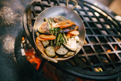 High angle view of meat on barbecue grill