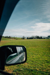 Reflection of road on field