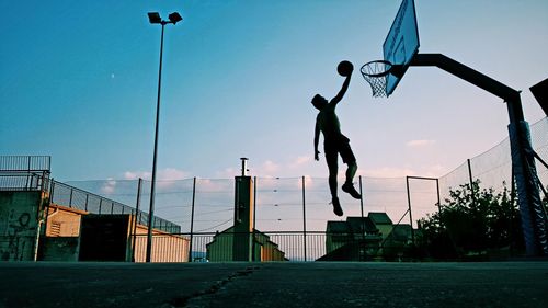 Low angle view of basketball hoop against sky