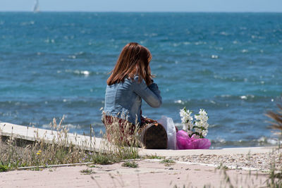 Woman with umbrella on beach