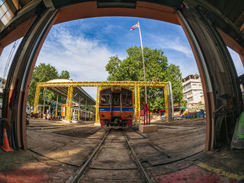 Train on railroad track against sky