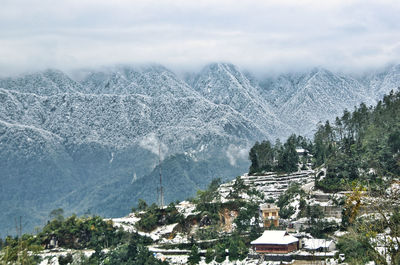 Snow covers the mountains and roofs during the first snowfall in sapa, lao cai, vietnam