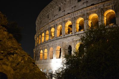 Exterior of historic building against sky at night