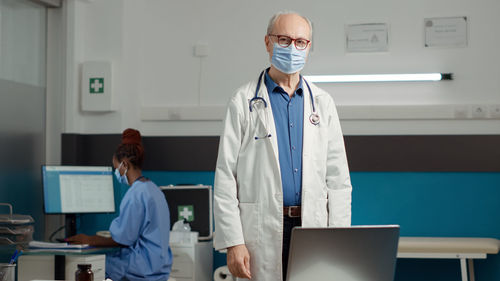 Portrait of female doctor working in office