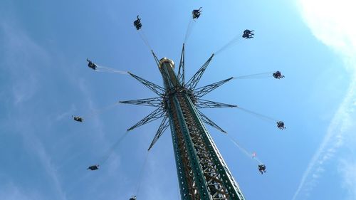 Low angle view of ferris wheel against sky