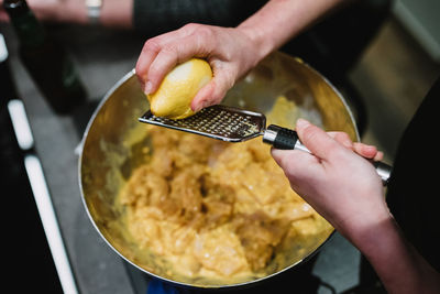 Midsection of person preparing food