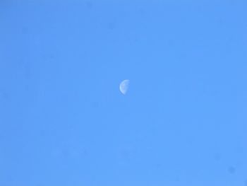Close-up of moon against clear blue sky