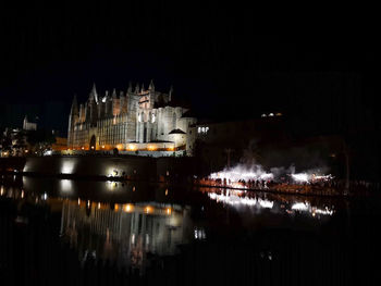Illuminated buildings in city at night