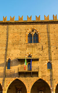 Low angle view of old building against clear sky