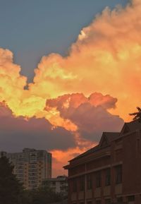 Low angle view of buildings against sky during sunset