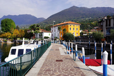 Scenic view of buildings and mountains against sky