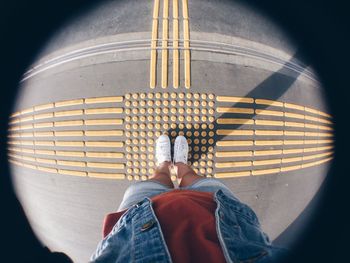 Low section of woman standing on floor