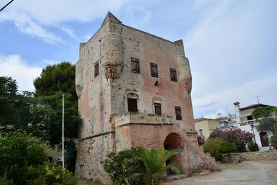 Low angle view of old ruins against sky