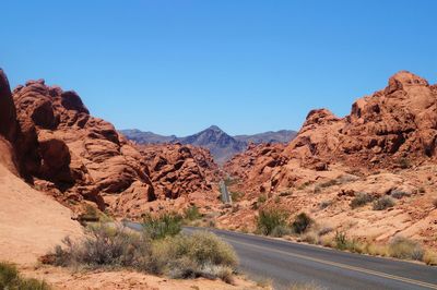 Scenic view of mountains against clear blue sky