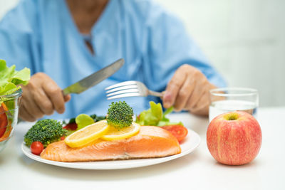 Midsection of man having food