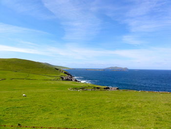 Scenic view of sea against cloudy sky