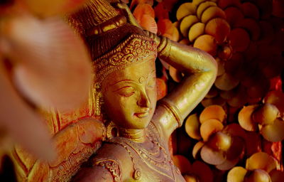 Close-up of buddha statue in temple