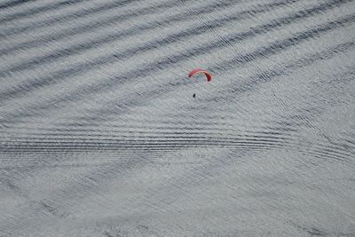 Close-up of person paragliding