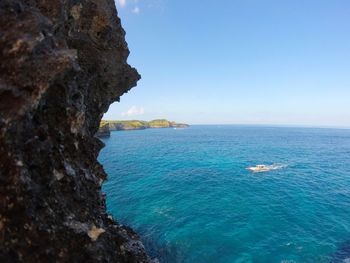 Scenic view of sea against blue sky