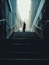 Low angle view of people walking up stairs