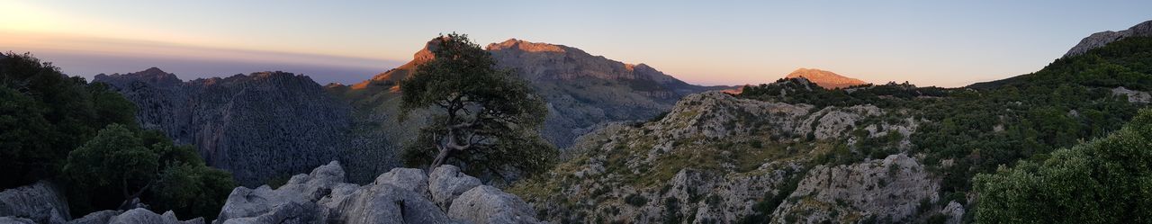 Panoramic view of mountains against sky during sunset