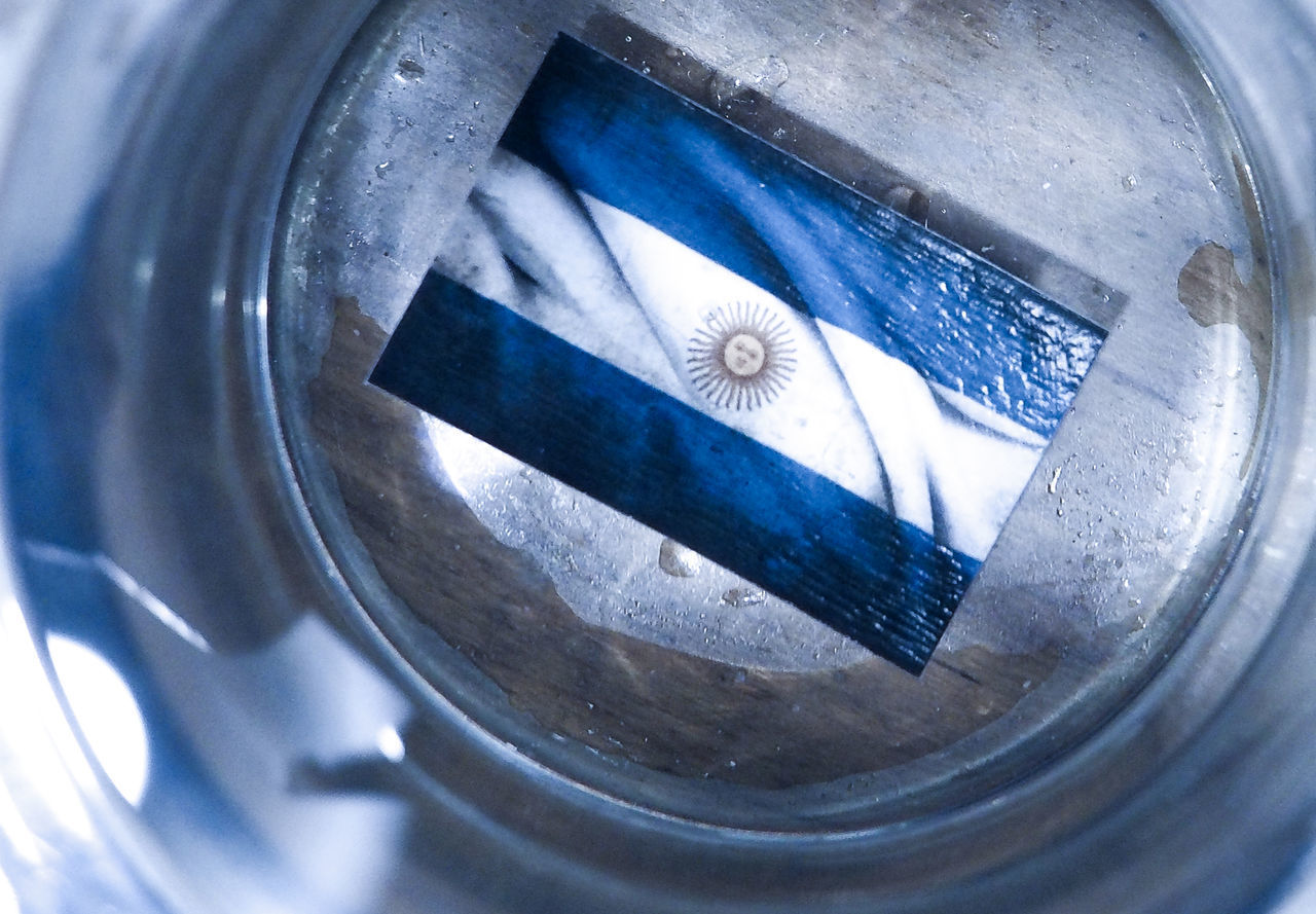 HIGH ANGLE VIEW OF REFLECTION ON METAL