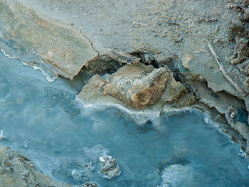 Close-up of rock formation in water