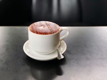 Close-up of coffee cup on table