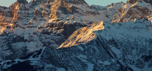 Aerial view of snowcapped mountains during winter