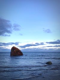 Scenic view of sea against sky at sunset