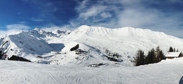 Scenic view of snowcapped mountains against sky