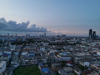 High angle view of buildings in city against sky