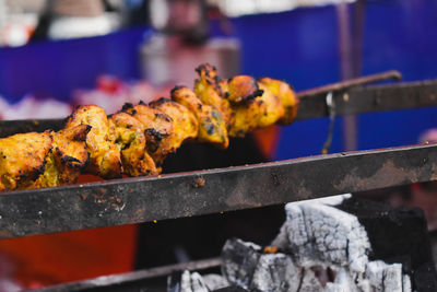 Close-up of meat on barbecue grill